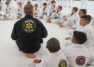 instructor talking to martial arts students